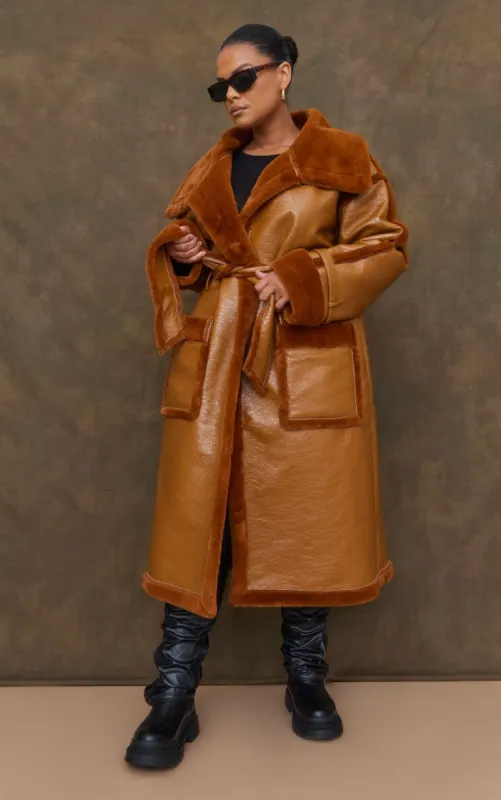 Plus Camel Vinyl Contrast Faux Fur Midi Coat sold by Pretty Little Thing