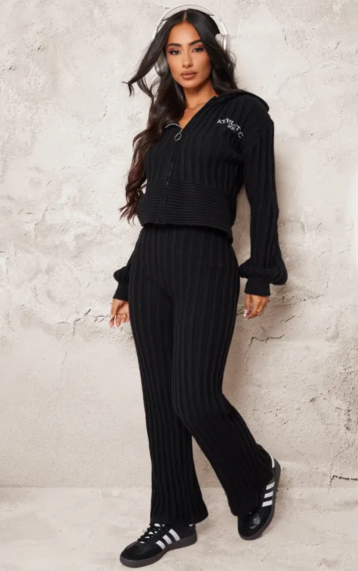 Petite Black Athletic Sport Embroidered Knit Flared Trousers sold by Pretty Little Thing