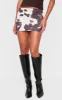 Brown Slinky Basic Cow Print Low Rise Extreme Micro Mini Skirt sold by Pretty Little Thing