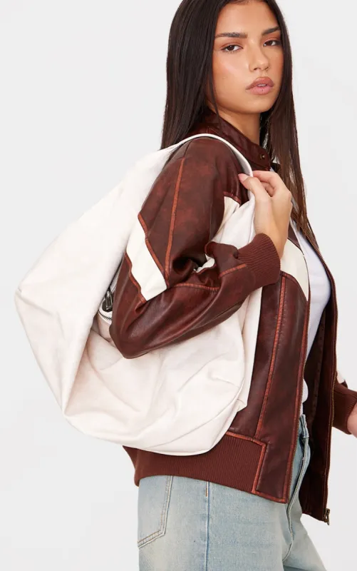 Cream Distressed PU Super Slouchy Tote Bag sold by Pretty Little Thing