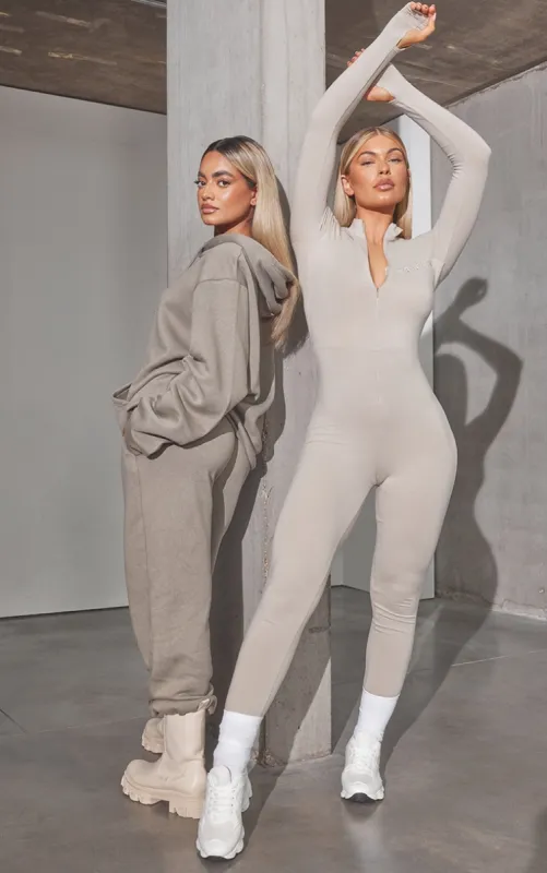 PRETTYLITTLETHING Washed Stone Long Sleeve Catsuit sold by Pretty Little Thing