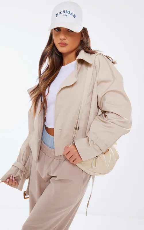Camel Belted Hem Cropped Trench Coat sold by Pretty Little Thing