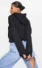 Black Over sized Crop Hoodie sold by Pretty Little Thing