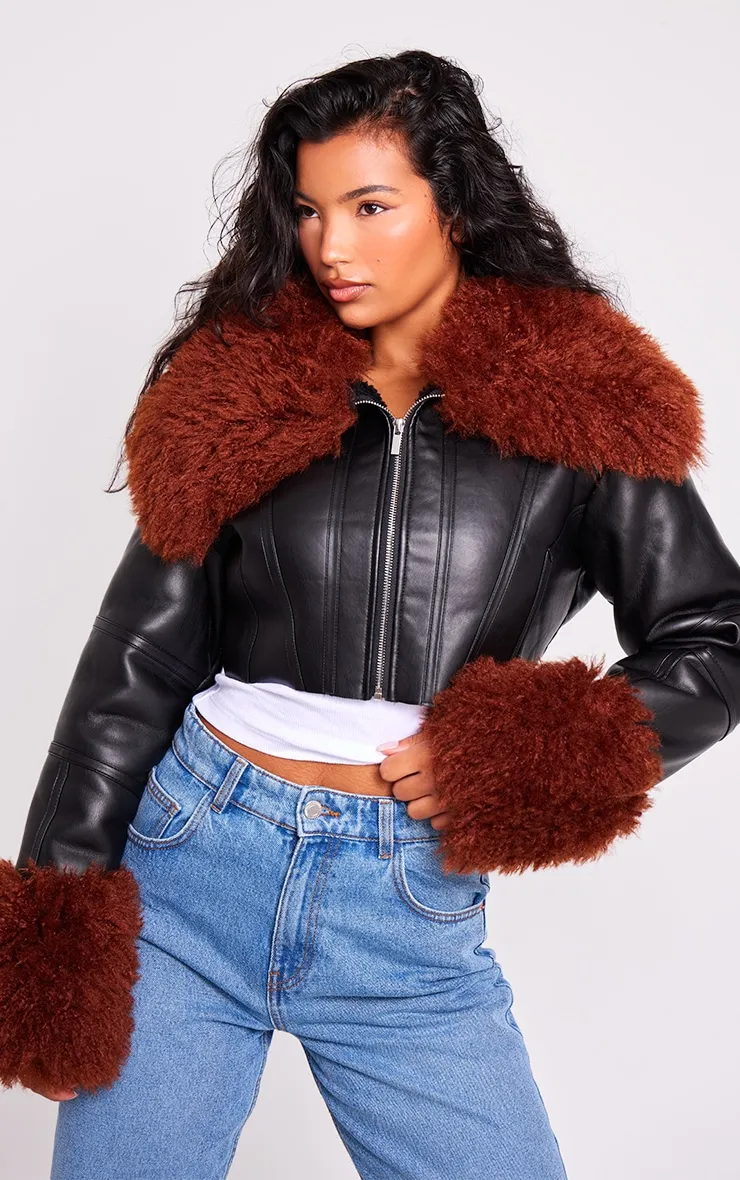 Black Corset Panelled Faux Mongolian Fur Trim Faux Leather Jacket sold by Pretty Little Thing