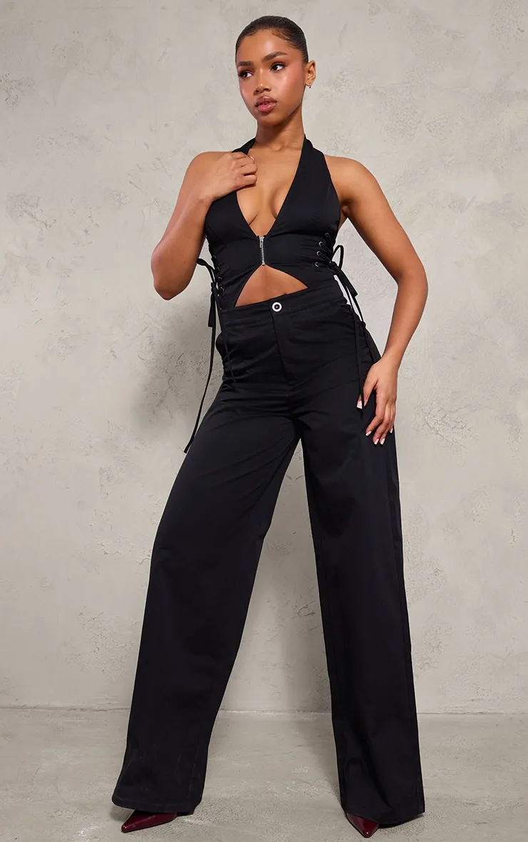 Black Woven Halter Zip Detail Lace Up Jumpsuit sold by Pretty Little Thing