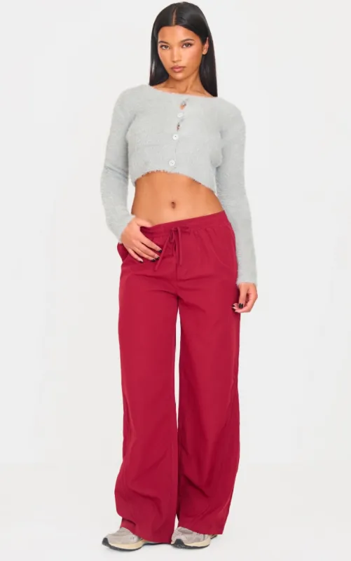 Burgundy Asymmetric Side Stripe Detail Track Pants sold by Pretty Little Thing