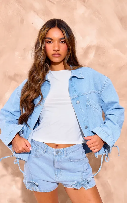 Light Blue Wash Lace Up Bow Detail Cropped Denim Jacket sold by Pretty Little Thing