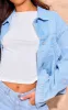 Light Blue Wash Lace Up Bow Detail Cropped Denim Jacket sold by Pretty Little Thing