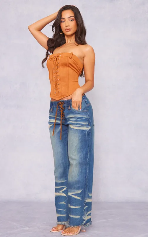 Petite Mid Blue Wash Low Rise Lace Up Wide Leg Jeans sold by Pretty Little Thing