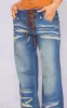 Petite Mid Blue Wash Low Rise Lace Up Wide Leg Jeans sold by Pretty Little Thing