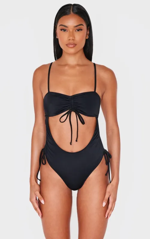 Black Ruched Cut Out Halter Tie Swimsuit sold by Pretty Little Thing