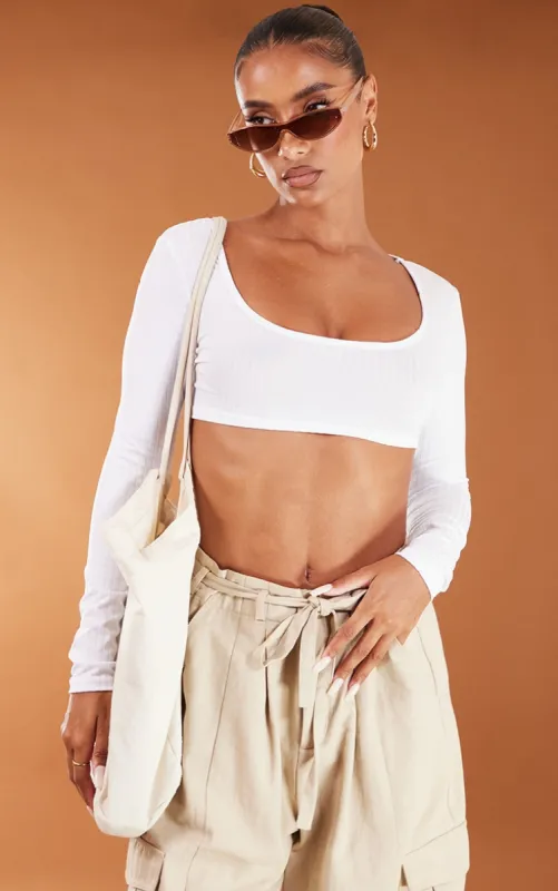 Basic White Rib Long Sleeve Crop Top sold by Pretty Little Thing
