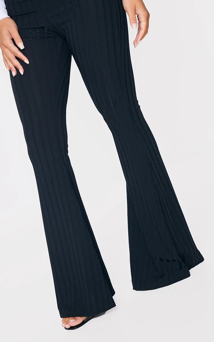 Petite Black Flared Trousers sold by Pretty Little Thing product image thumbnail 4