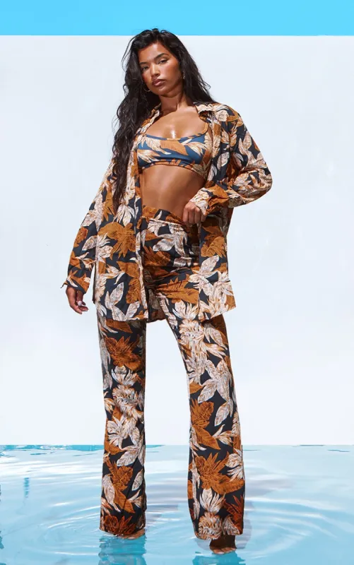 Black Palm Leaf Print Beach Flares sold by Pretty Little Thing