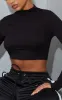 Black High Neck Long Sleeve Crop Top sold by Pretty Little Thing