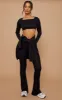 Petite Basic Black Jersey Wide Leg Flares sold by Pretty Little Thing