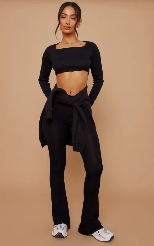 Petite Basic Black Jersey Wide Leg Flares sold by Pretty Little Thing