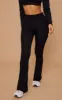 Petite Basic Black Jersey Wide Leg Flares sold by Pretty Little Thing