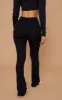 Petite Basic Black Jersey Wide Leg Flares sold by Pretty Little Thing
