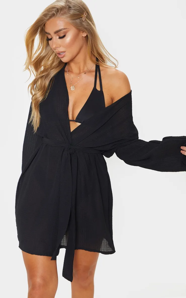 Black Crinkle Textured Short Beach Kimono sold by Pretty Little Thing