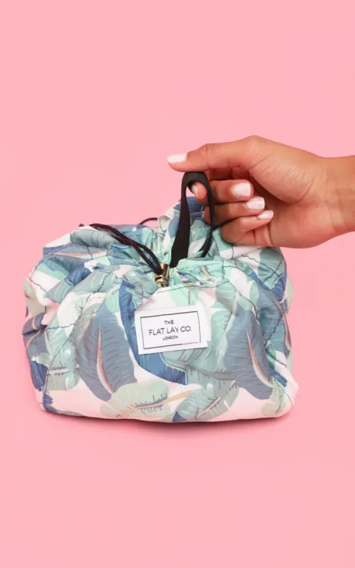 The Flat Lay co. Makeup Bag Tropical Leaves sold by Pretty Little Thing