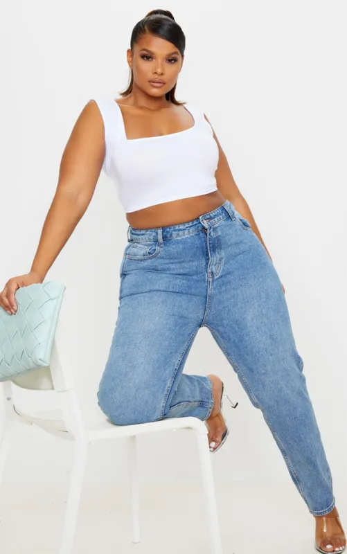 Plus Mid Washed Mom Jeans sold by Pretty Little Thing