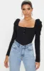 Black Rib Puff Long Sleeve Bodysuit sold by Pretty Little Thing