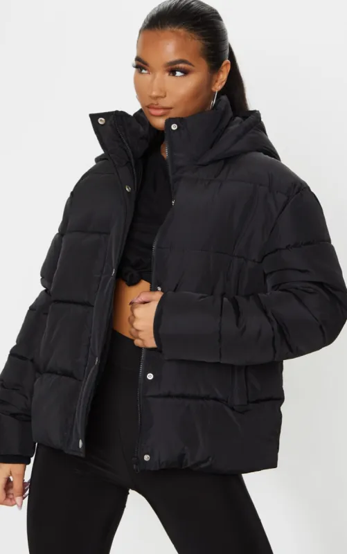 Black Hooded Puffer Jacket sold by Pretty Little Thing