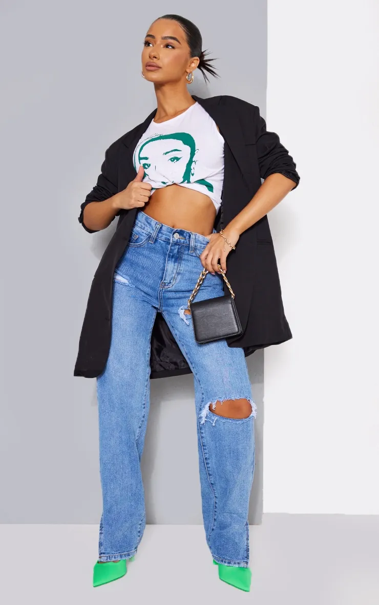 Petite Mid Blue Wash Ripped Split Hem Jeans sold by Pretty Little Thing