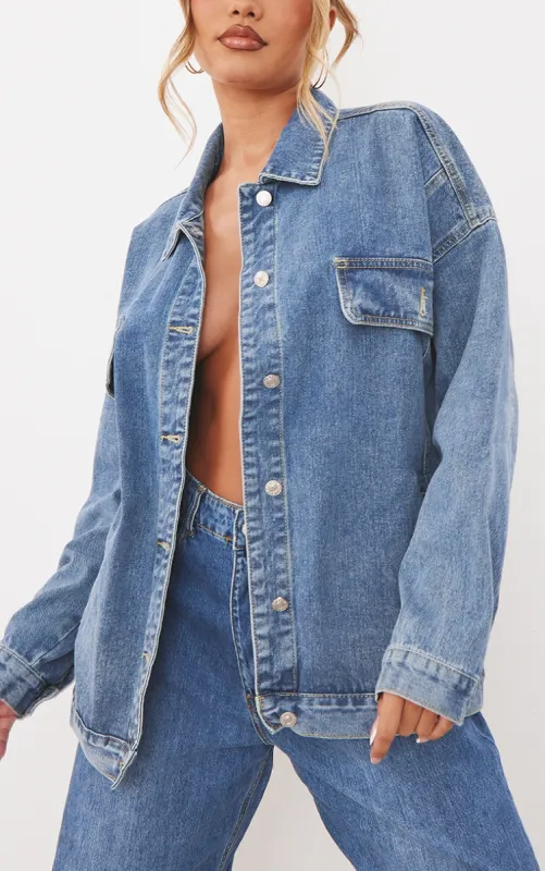 PRETTYLITTLETHING Mid Blue Wash Oversized Boyfriend Pocket Detail Denim Jacket sold by Pretty Little Thing