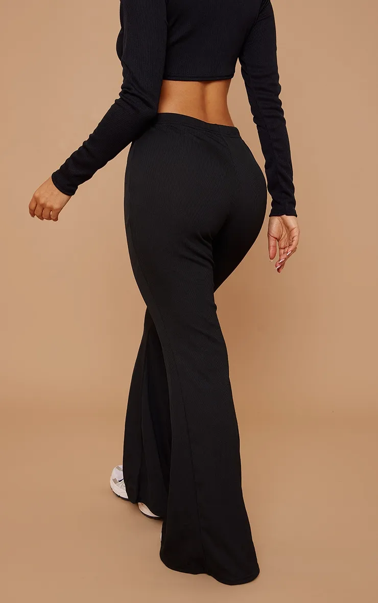 Petite Black Ribbed Flared Trousers sold by Pretty Little Thing product image thumbnail 3