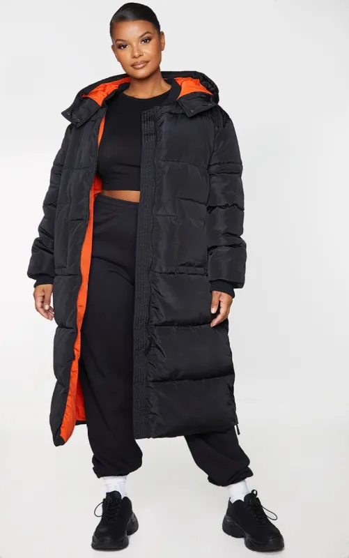Plus Black Maxi Contrast Hooded Puffer Jacket sold by Pretty Little Thing