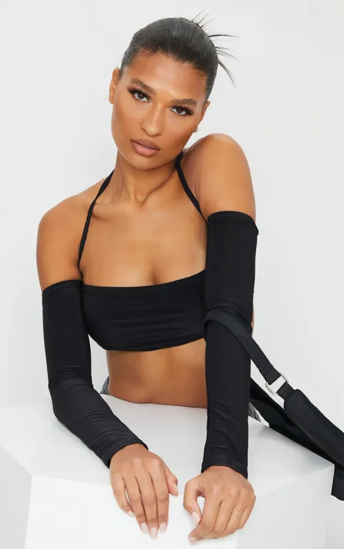Black Slinky Halterneck Long Sleeve Crop Top sold by Pretty Little Thing