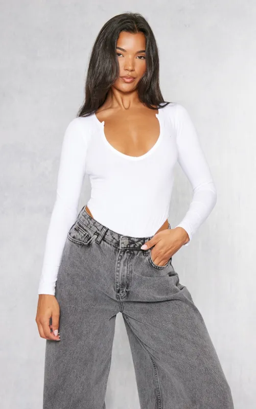 Basic White Cotton Blend Plunge Long Sleeve Bodysuit sold by Pretty Little Thing