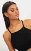 Basic Black Cotton Blend Racer Neck Crop Top sold by Pretty Little Thing
