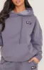 PRETTYLITTLETHING Petite Charcoal Badge Detaill Oversized Hoodie sold by Pretty Little Thing