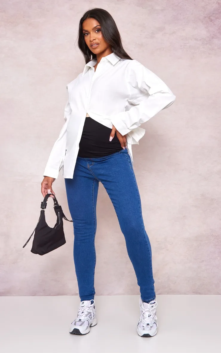 Maternity Mid Blue Wash Skinny Jeans sold by Pretty Little Thing