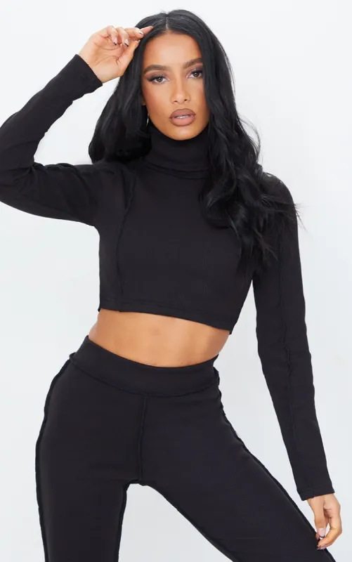 Black Structured Rib High Neck Stitch Detail Long Sleeve Crop Top sold by Pretty Little Thing