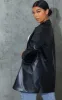 Black PU Pocket Look Double Button Blazer sold by Pretty Little Thing