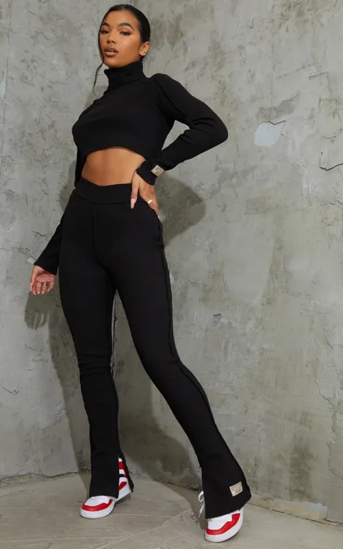 PRETTYLITTLETHING Black Badge Structured Rib Split Hem Flare Trousers sold by Pretty Little Thing