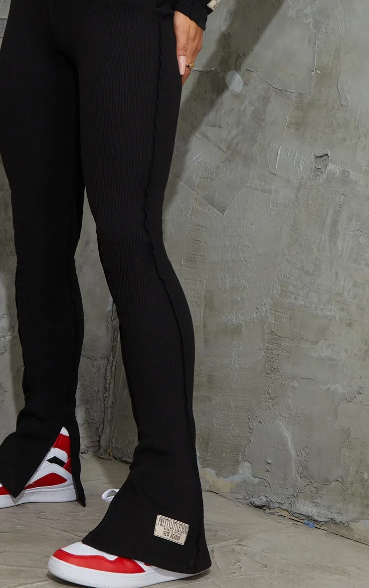 PRETTYLITTLETHING Black Badge Structured Rib Split Hem Flare Trousers sold by Pretty Little Thing product image thumbnail 4