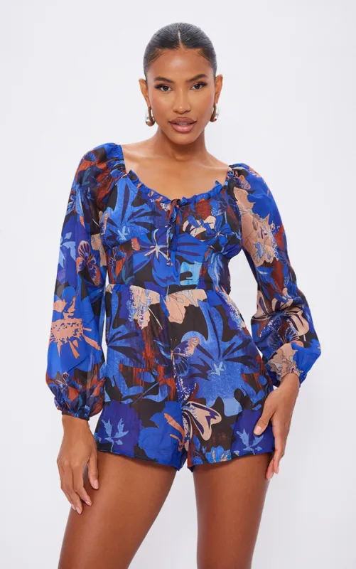 Blue and Brown Printed Tie Back Cut Out Playsuit sold by Pretty Little Thing