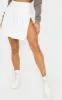 White Pleated Side Split Tennis Skirt sold by Pretty Little Thing