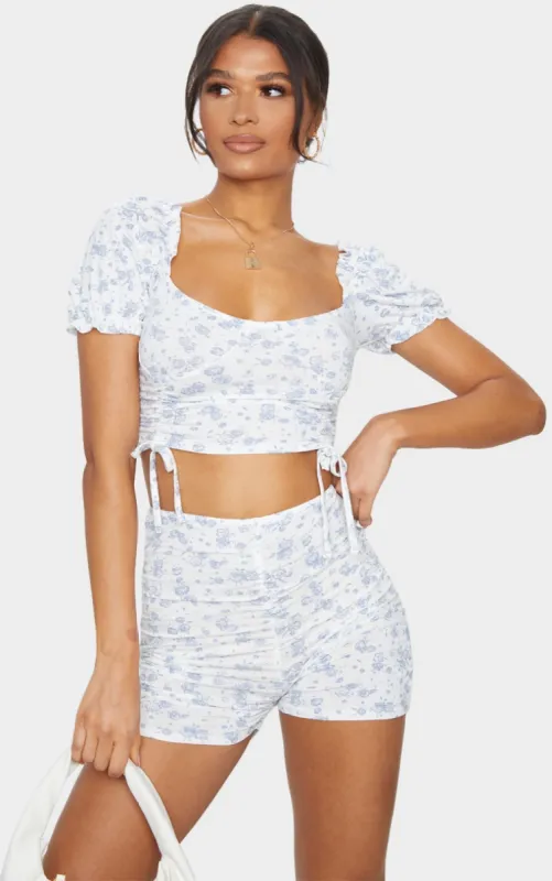 Blue Printed Jersey Puff Sleeve Ruched Front Crop Top sold by Pretty Little Thing