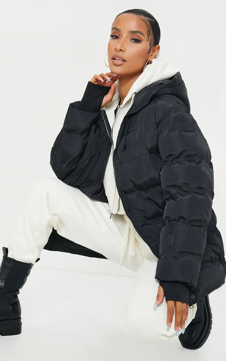 Black Quilted Belted Cuffed Sleeve Puffer Coat. sold by Pretty Little Thing