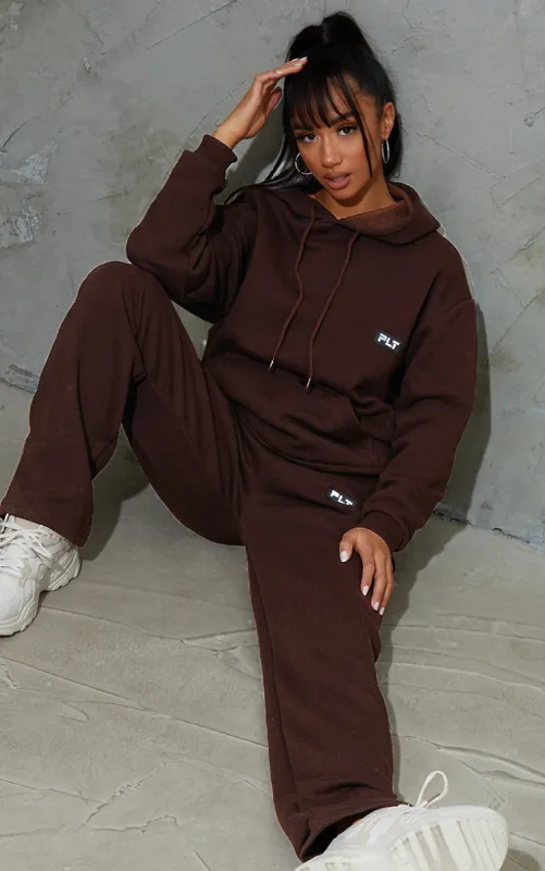 PRETTYLITTLETHING Petite Chocolate Badge Detail Straight Leg Joggers sold by Pretty Little Thing