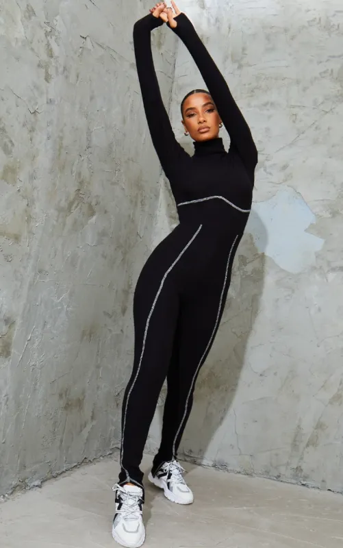 Black Brushed Rib Seam Detail High Neck Split Hem Jumpsuit sold by Pretty Little Thing