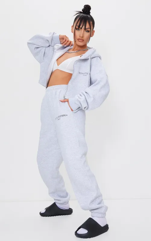 PRETTYLITTLETHING Grey Marl Copyright Slogan Joggers sold by Pretty Little Thing