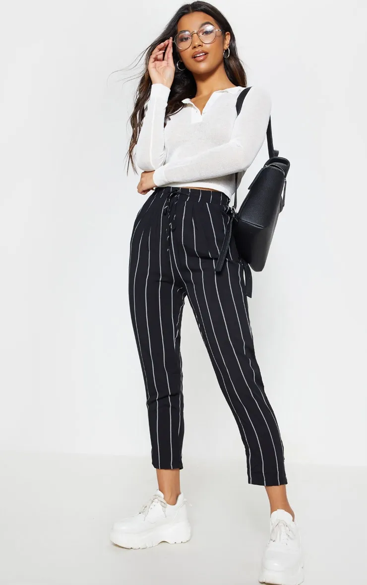 Diya Black Pin Stripe Casual Trousers sold by Pretty Little Thing