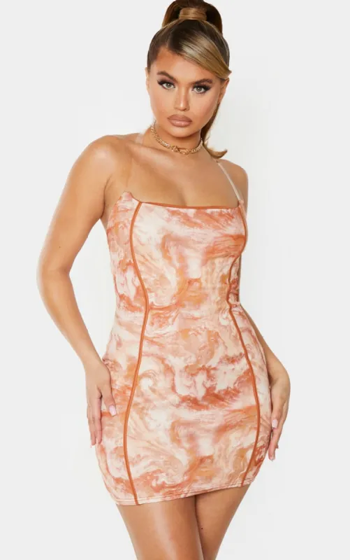 Tan Marble Print Binded Detail Clear Strap Bodycon Dress sold by Pretty Little Thing